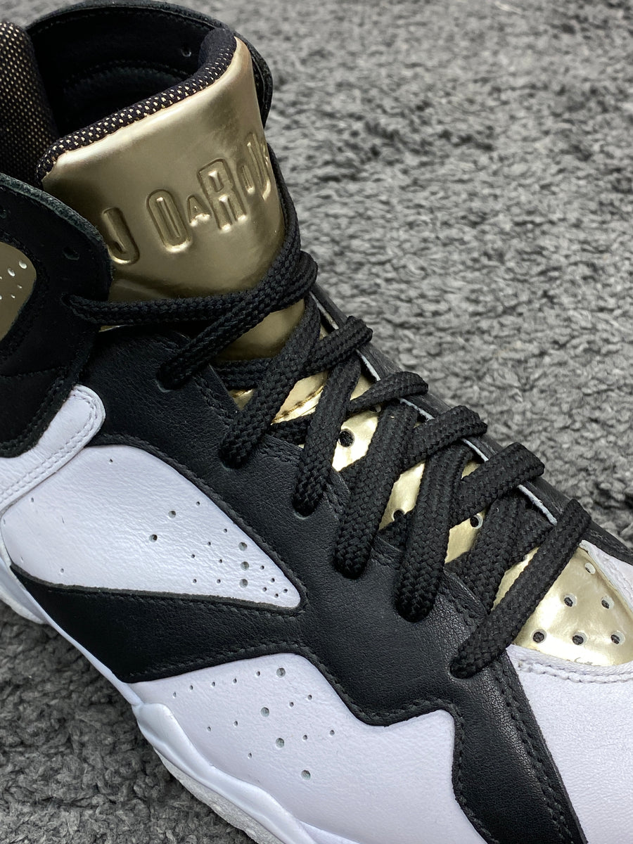 Air jordan 7 black best sale and gold